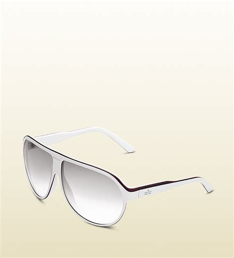 large aviator frame sunglasses with gucci trademark logo on temple|Aviator frame sunglasses in gold.